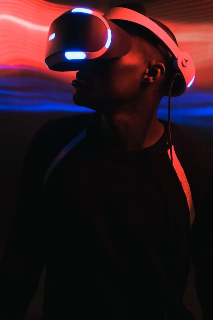 Man immersed in virtual reality with a glowing headset and neon lights around.